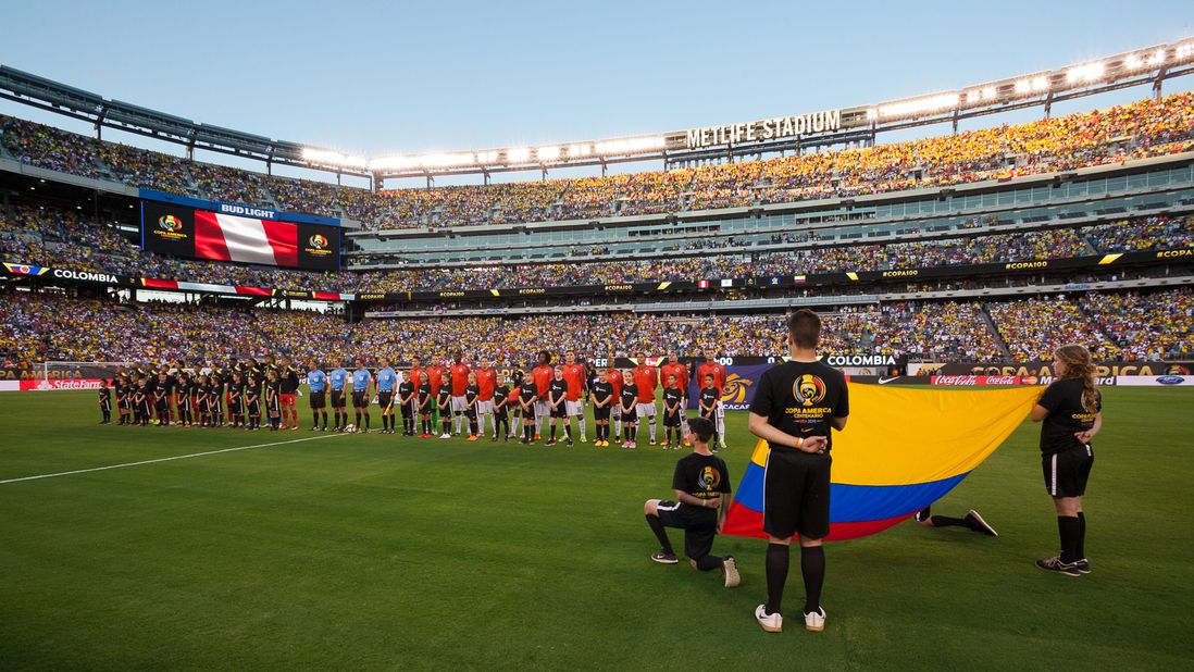 Starters for Colombia and Peru stand during pre-match ceremonies.
